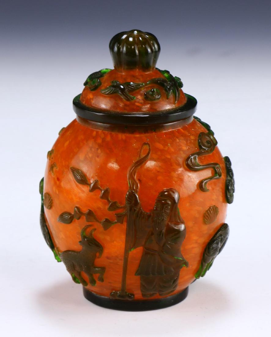 A CHINESE ANTIQUE OVERLAY PEKING GLASS VASE: A Chinese Antique Overlay Peking Glass Vase: Of Ovoid Form, Orange Body Overlaid With A Skillfully Figure Amid Mountain Goats And A Sprouting Tree, Four Character Mark incised On The Base Within A Dou