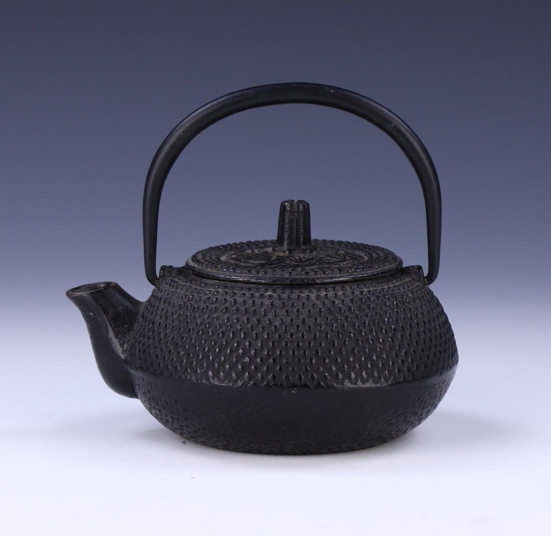 A JAPANESE ANTIQUE IRON TEAPOT: A Japanese Antique Iron Teapot: Of 19Th Century; Size: L: 5" (12.7cm)