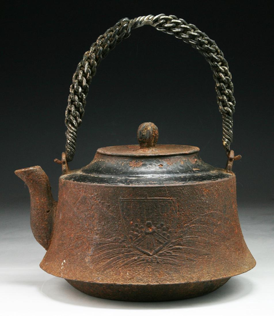 A JAPANESE ANTIQUE IRON TEAPOT: A Japanese Antique Iron Teapot; Size: H: 12" (30.48cm); L: 10" (25.4cm)
