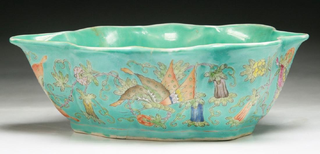 A CHINESE ANTIQUE LEAF SHAPED FAMILLE ROSE PORCELAIN: A Chinese Antique Leaf Shaped Famille Rose Porcelain Bowl: The Six Character 'Jiaqing' Reign Mark Signed in Iron Red On The Base And Of Qing Dynasty; Size: L: 7-3/4" (19.69cm)