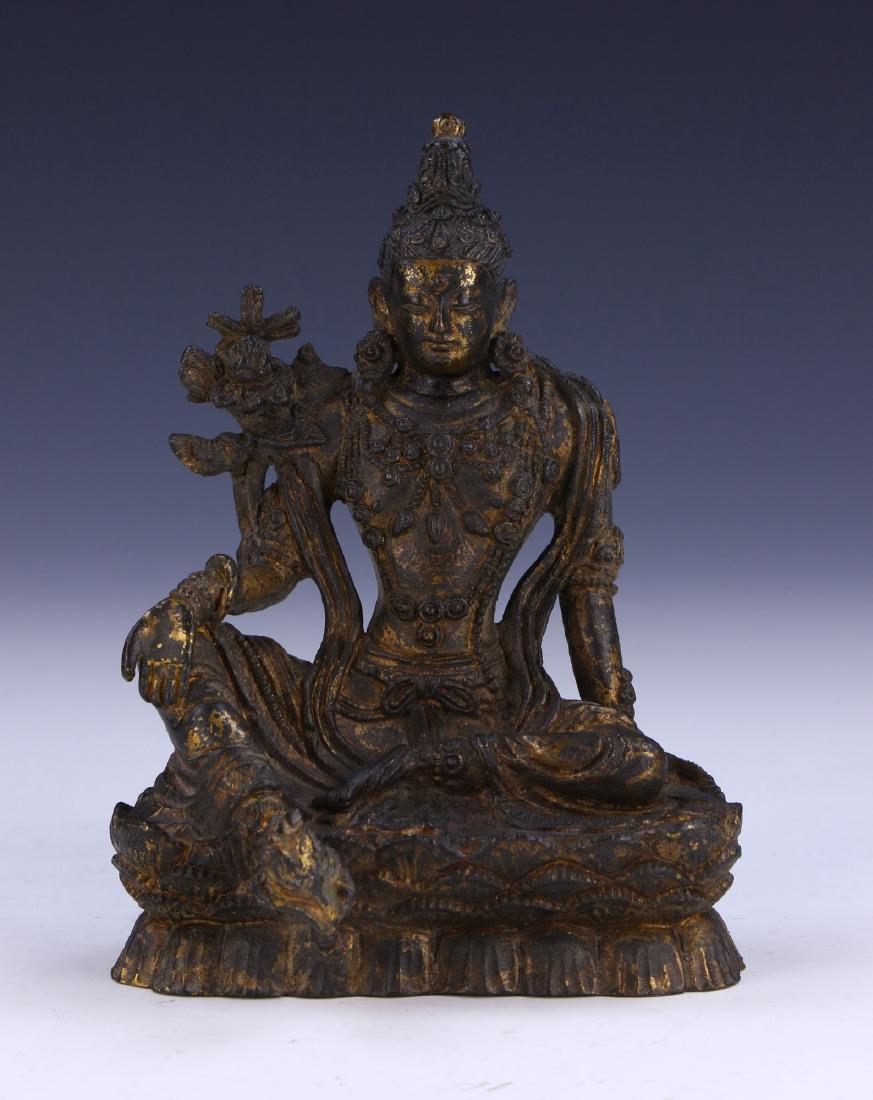A TIBETAN ANTIQUE BRONZE GREEN TARA: A Tibetan Antique Bronze Green Tara: Finely Cast And Shown in A Seated Position Atop A Double Layer Plinth, Dressed in Traditional Loose Robes With An Elegant Headdress; Size: H: 5-3/4" (14.61cm)