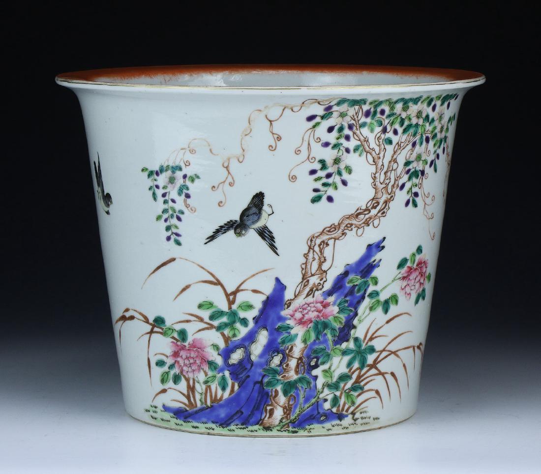 A CHINESE ANTIQUE FAMILLE ROSE PORCELAIN PLANTER: A Chinese Antique Famille Rose Porcelain Planter: Of Globular Form, The Exterior Finely Painted With Blossoming Trees And Birds; Size: D: 9-1/4" (23.50cm); H: 7-1/4" (18.42cm)