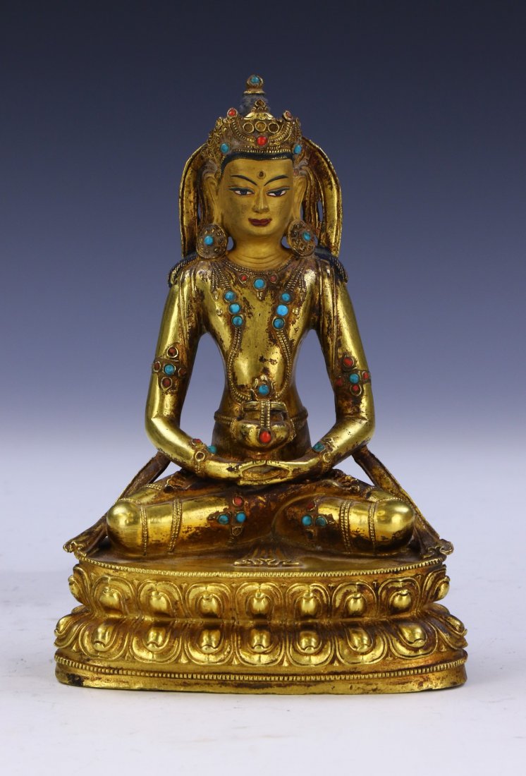 A TIBETAN ANTIQUE JEWELED GILT BRONZE BUDDHA: A TIBETAN ANTIQUE JEWELED GILT BRONZE BUDDHASize: H: 7-1/4" (18.42cm)