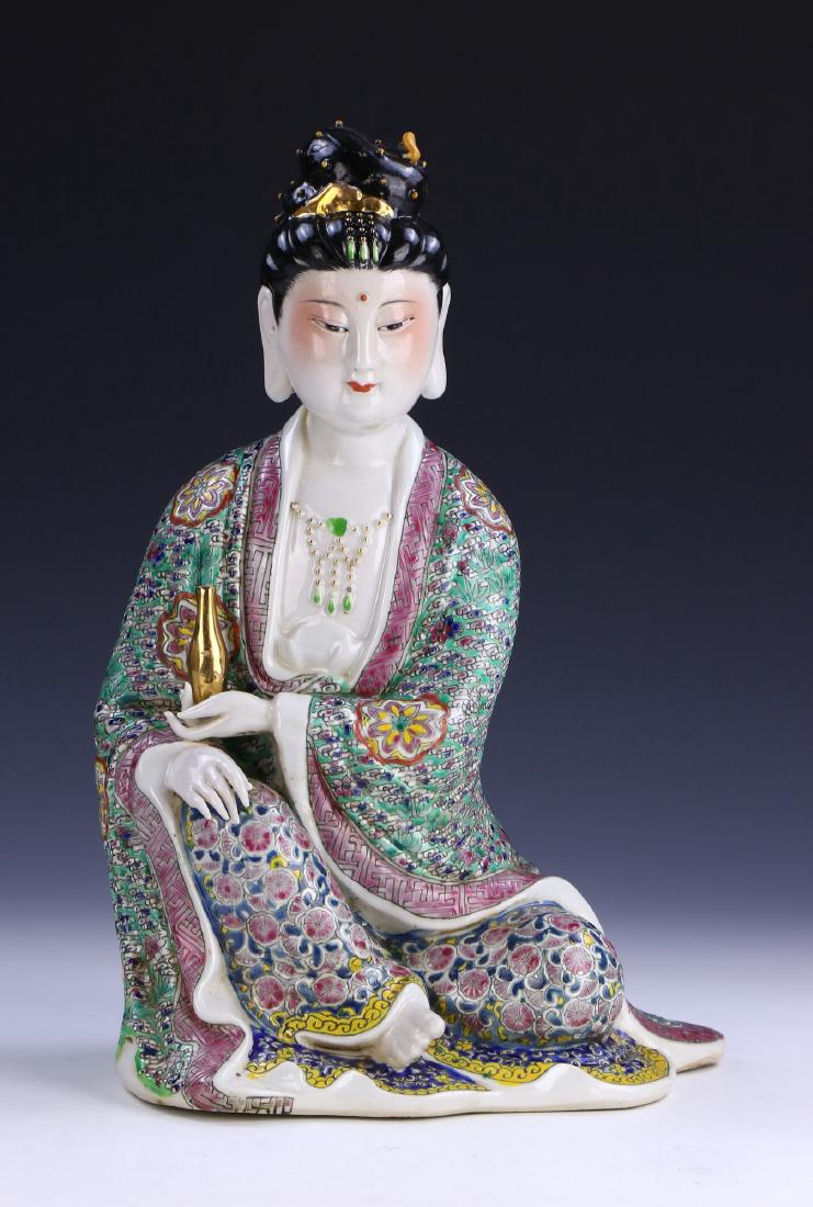 A CHINESE ANTIQUE FAMILLE ROSE PORCELAIN BEAUTY: A Chinese Antique Famille Rose Porcelain Beauty: Finely Potted And Shown in A Resting Position, Hair Pulled Back in A High Bun, Dressed in Elegant Loose Robes Of Mixed Tones With A Gilt Glazed Bottle