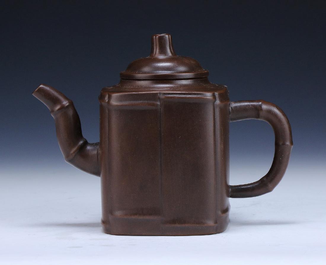 A Chinese Yixing Zisha Teapot: A Chinese Yixing Zisha Teapot; Size: L: 6-1/2"