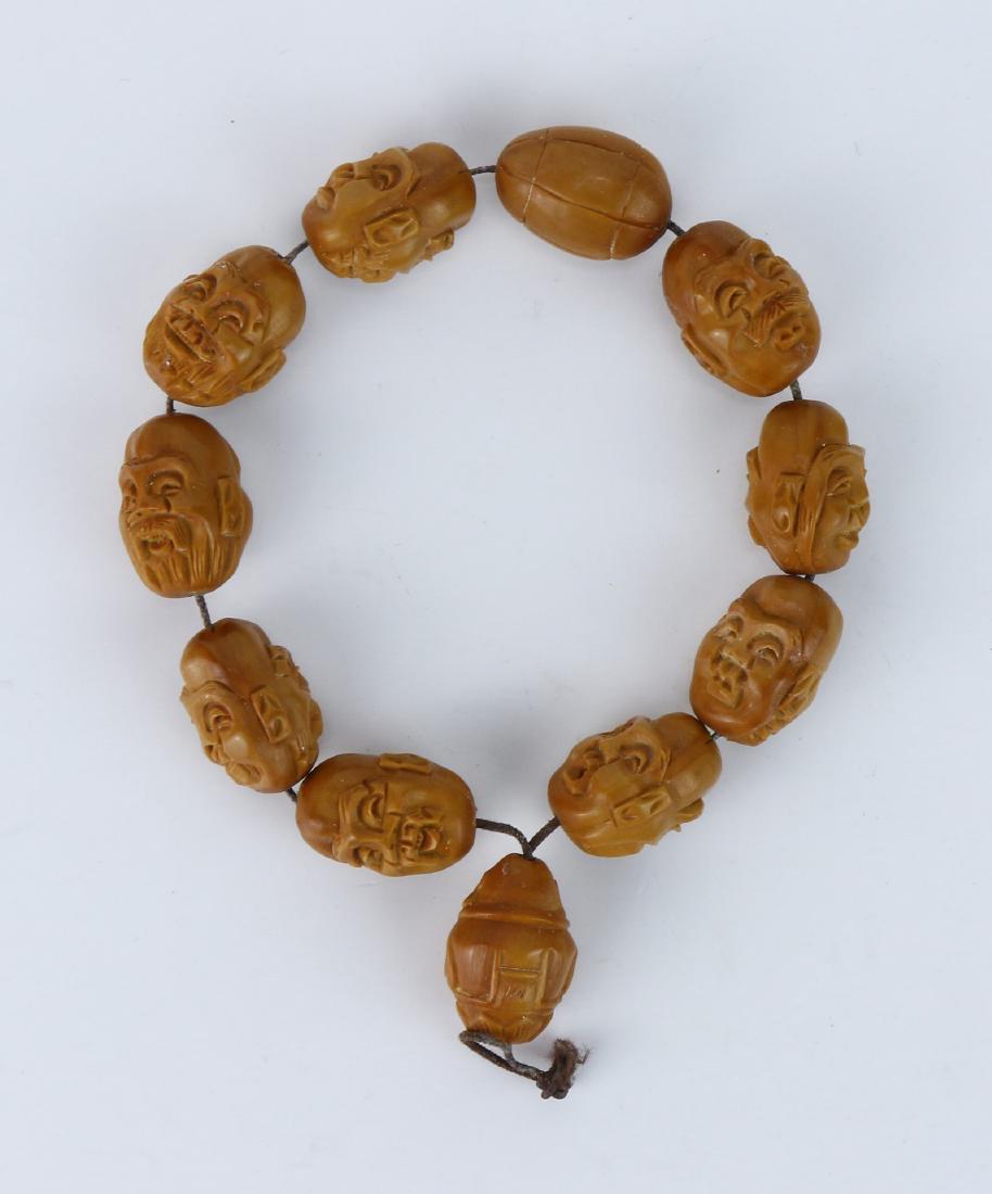 A CHINESE NUT CARVED BEADED BUDDHA BRACELET (1 of 1)