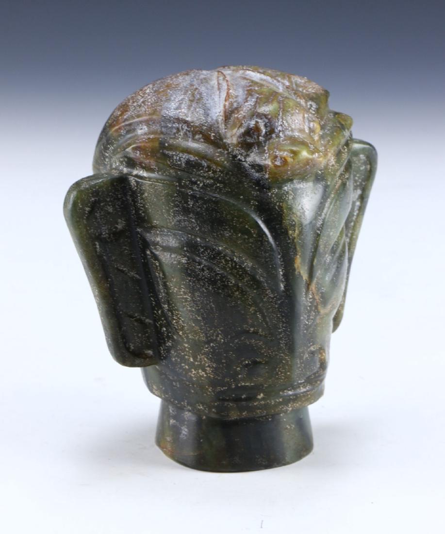 A CHINESE ANTIQUE ARCHAIC JADE CARVING: A Chinese Antique Archaic Jade Carving: Finely Carved, The Jade Of Mixed Medium To Dark Green Tones, Mottled On The Top With Light Brown Streaks; Size: H: 5-1/2" (13.97cm)