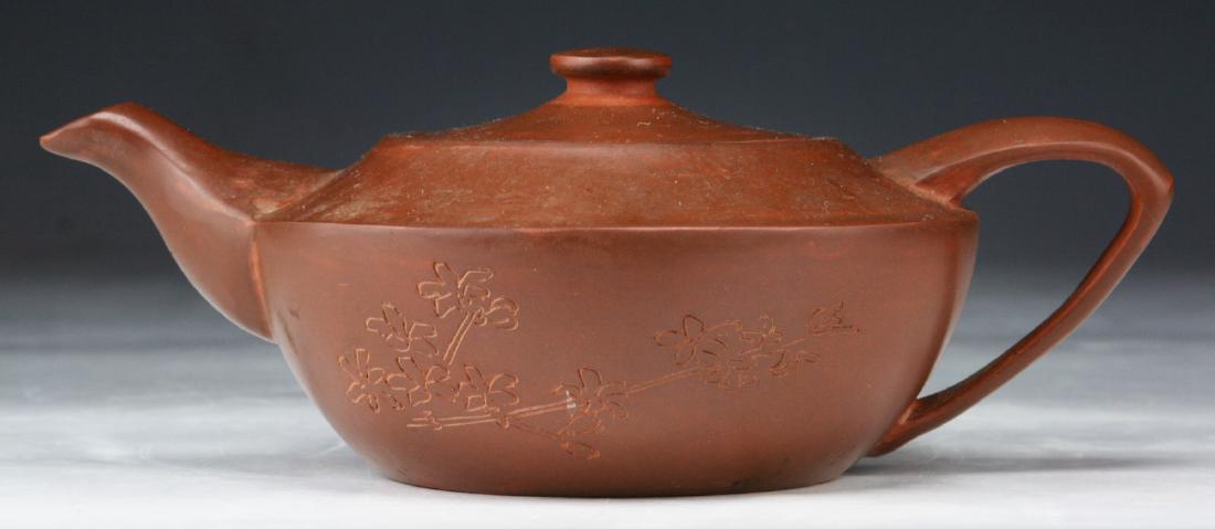A CHINESE ANTIQUE YIXING ZISHA TEAPOT: A Chinese Antique Yixing Zisha Teapot; Size: L: 8" (20.32cm)