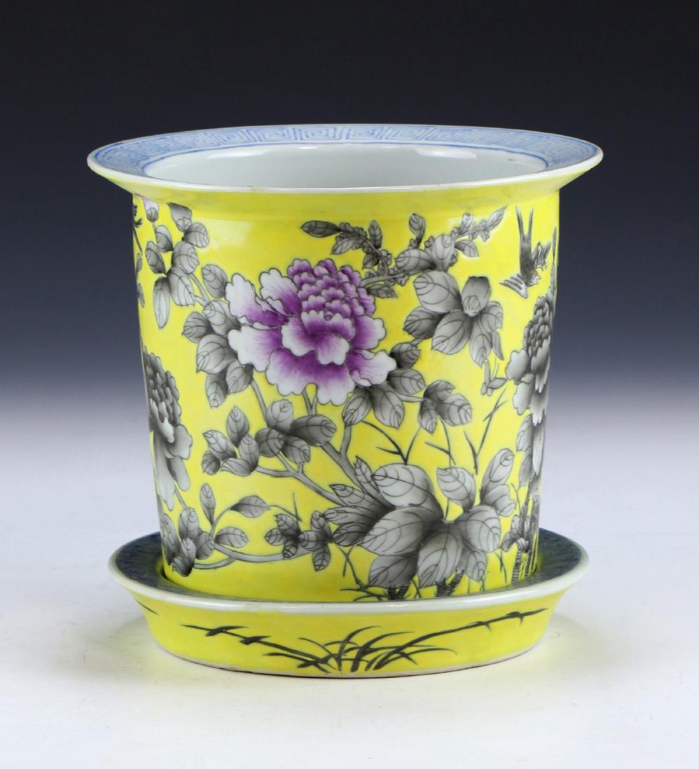 A CHINESE ANTIQUE FAMILLE ROSE GRISAILLE STYLE: A Chinese Antique Famille Rose Grisaille Style Porcelain Jardiniere & Stand: Of Cylindrical Form, Body Finely Painted With Blooming Flowers Amid Continuous Stems Set Against An Evenly Glazed Yellow Ba