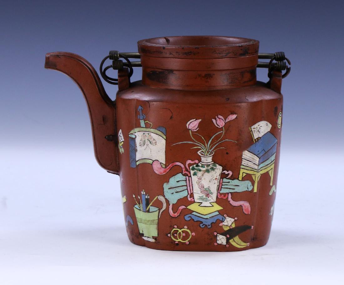 A CHINESE POLYCHROME YIXING ZISHA TEAPOT: A Chinese Polychrome Yixing Zisha Teapot: Of Lobed Rectangular Form, Rim Flanked On Each Side By A Small And Curling Handle, Body Finely Painted With Potted Blooming Flowers Amid Scholarly Objects; Si