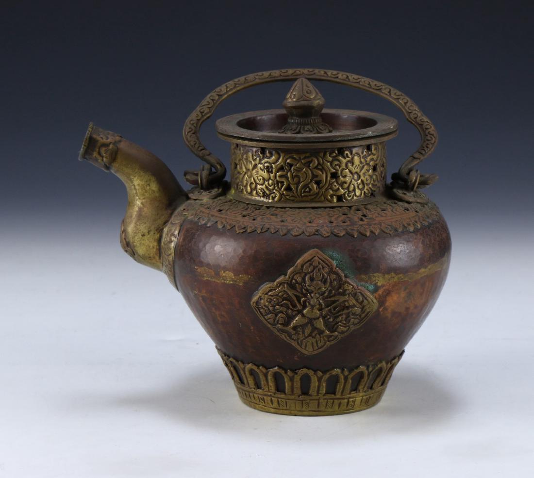 A TIBETAN ANTIQUE GILT BRONZE TEAPOT