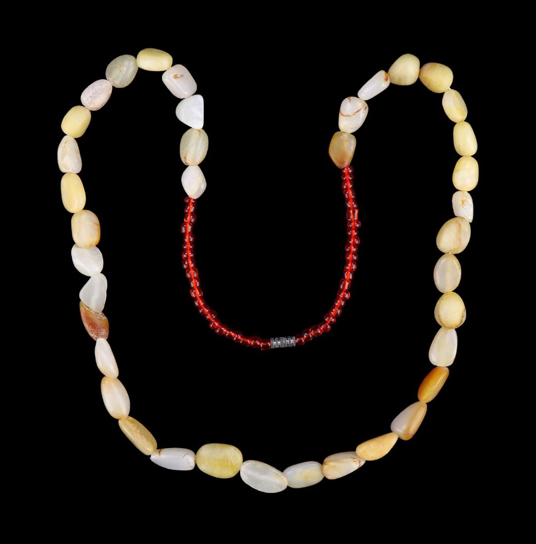 A CHINESE ARCHAIC JADE BEADED NECKLACE (1 of 2)