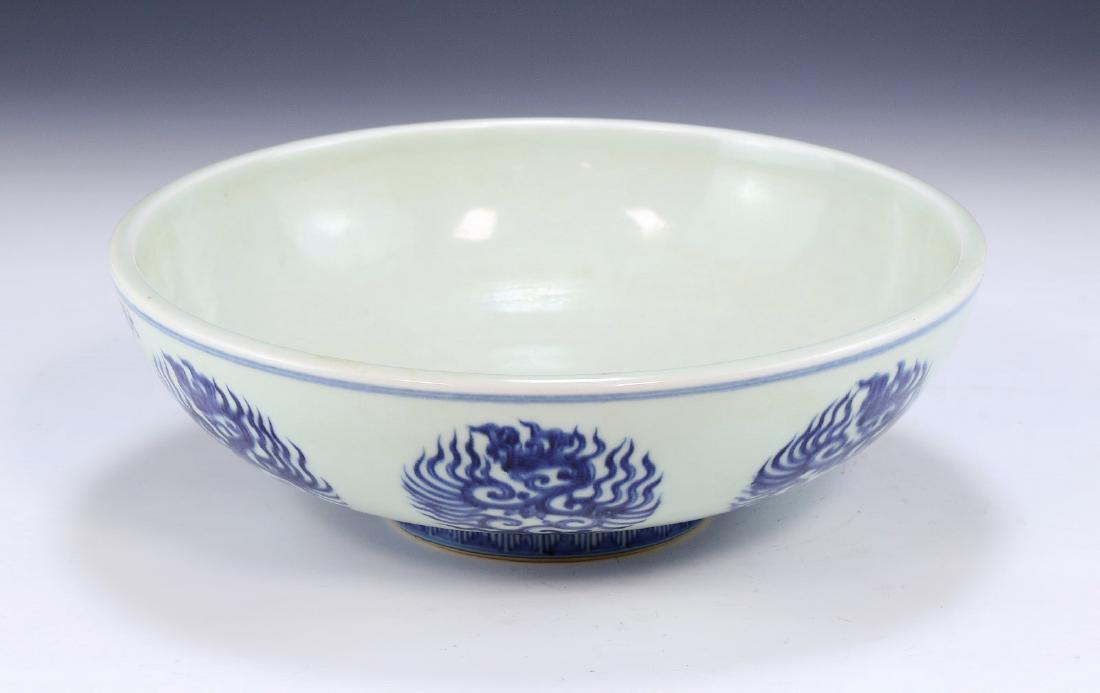 A CHINESE ANTIQUE BLUE & WHITE PORCELAIN BOWL: A Chinese Antique Blue & White Porcelain Bowl: Of Rounded Sides, Exterior Body Finely Painted With Seven Sprouting Blossoms Scenes, Shown Amid Continuous Swirling Stems; Size: D: 10-3/4" (27.31cm)
