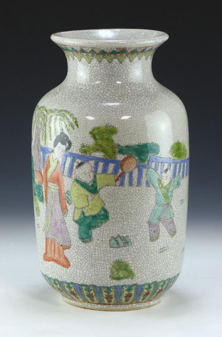 A CHINESE ANTIQUE FAMILLE ROSE PORCELAIN VASE: A Chinese Antique Famille Rose Porcelain Vase: Well Potted And Of Ovoid Form, Exterior Finely Painted With A Continuous Courtyard Scene, Body Ground Painted With A Crackle Finish, Four Character Qianl