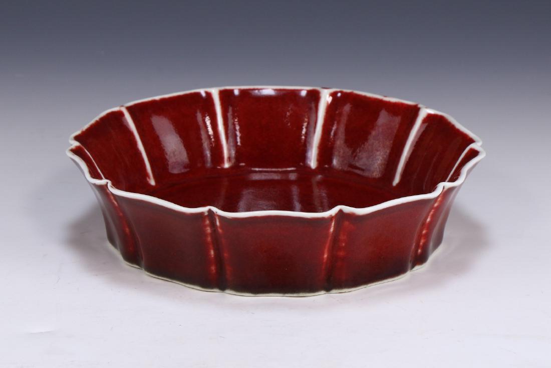 A CHINESE ANTIQUE OX BLOOD GLAZED PORCELAIN BOWL: A Chinese Antique Ox Blood Glazed Porcelain Bowl: Well Potted With Rounded Sides, Rising From A Wide Base Rested On Low Feet To A Decagonal Rim, Six Character Mark On The Base in Cobalt Blue Within A