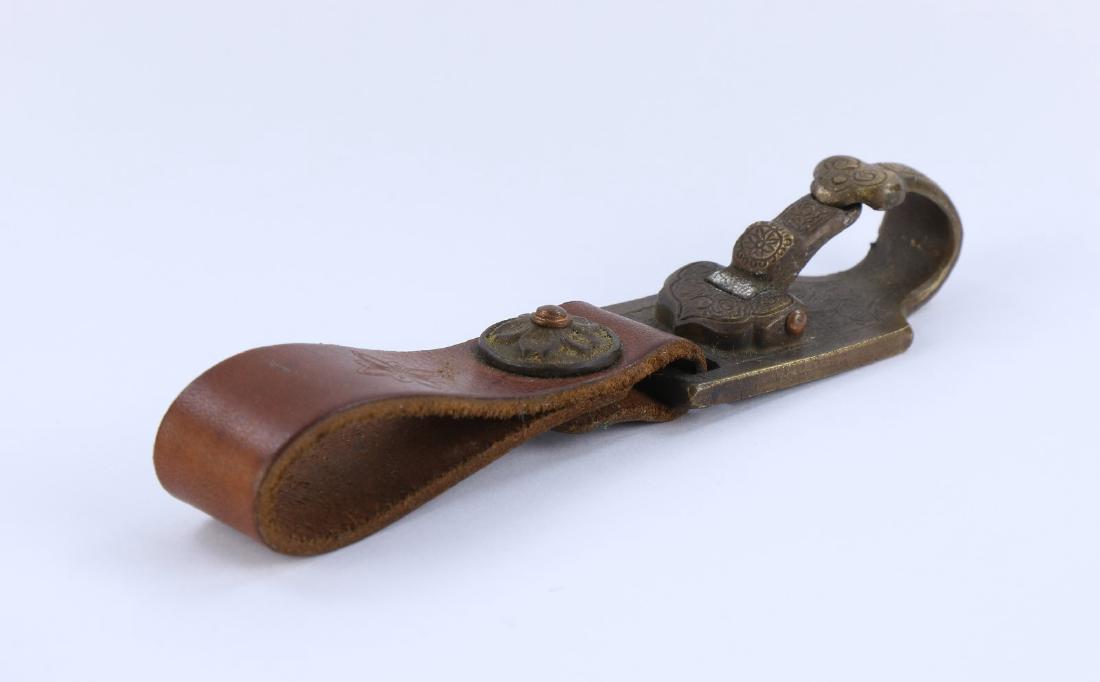 A CHINESE ANTIQUE BRONZE & OX HIDE BELT BUCKLE: A Chinese Antique Bronze & Ox Hide Belt Buckle: Buckle Finely Cast With Sprouting Blossoms Set in High Relief, Likely Of Early Qing Dynasty; Size: L: 5" (12.7cm)