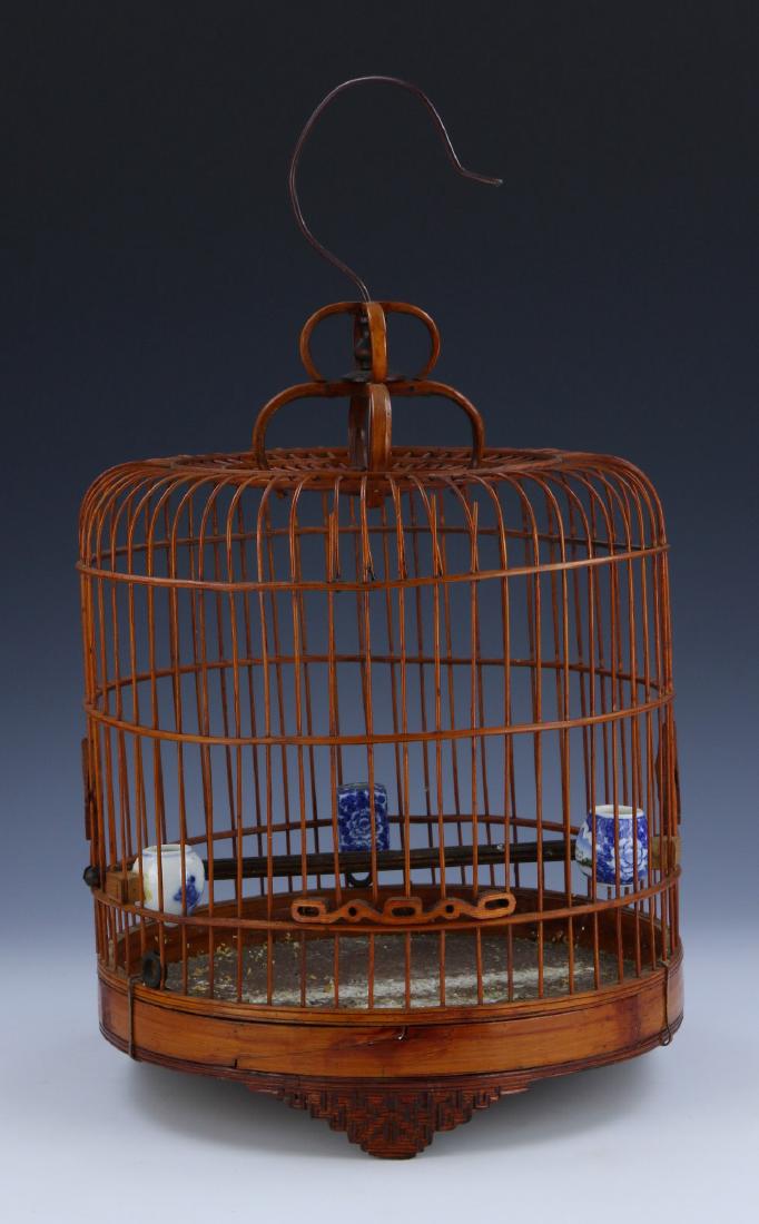 A WOOD CARVED BIRD CAGE (1 of 3)