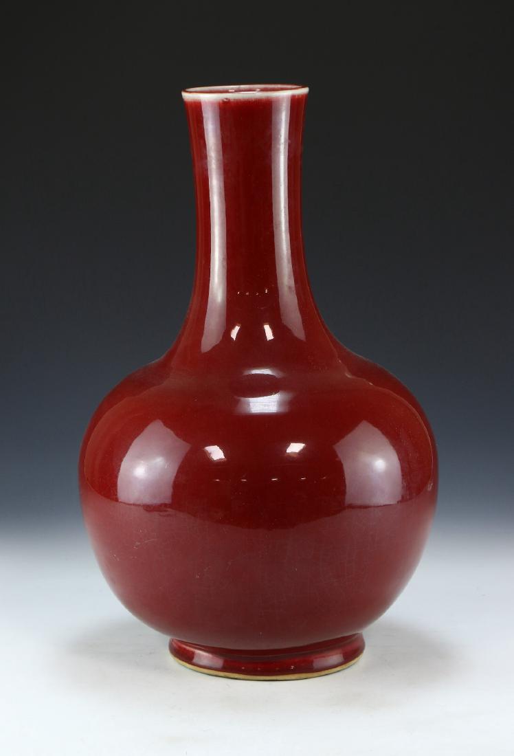 A CHINESE ANTIQUE OX BLOOD GLAZED PORCELAIN VASE (1 of 5)
