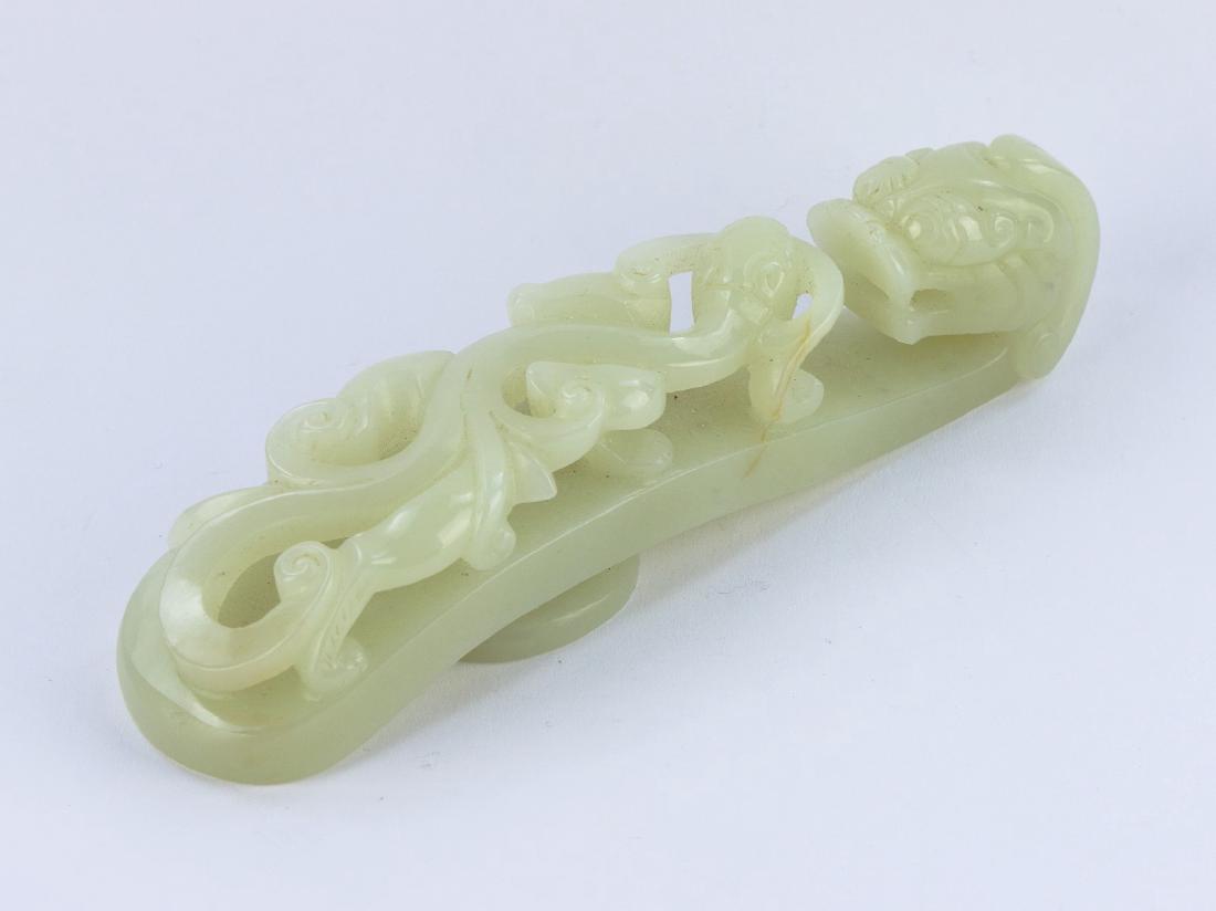 A CHINESE NEPHRITE WHITE JADE BUCKLE (1 of 4)