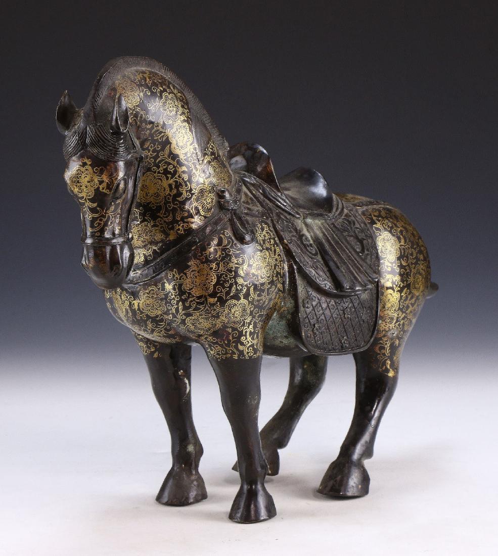 A CHINESE ANTIQUE GILT BRONZE HORSE (1 of 5)