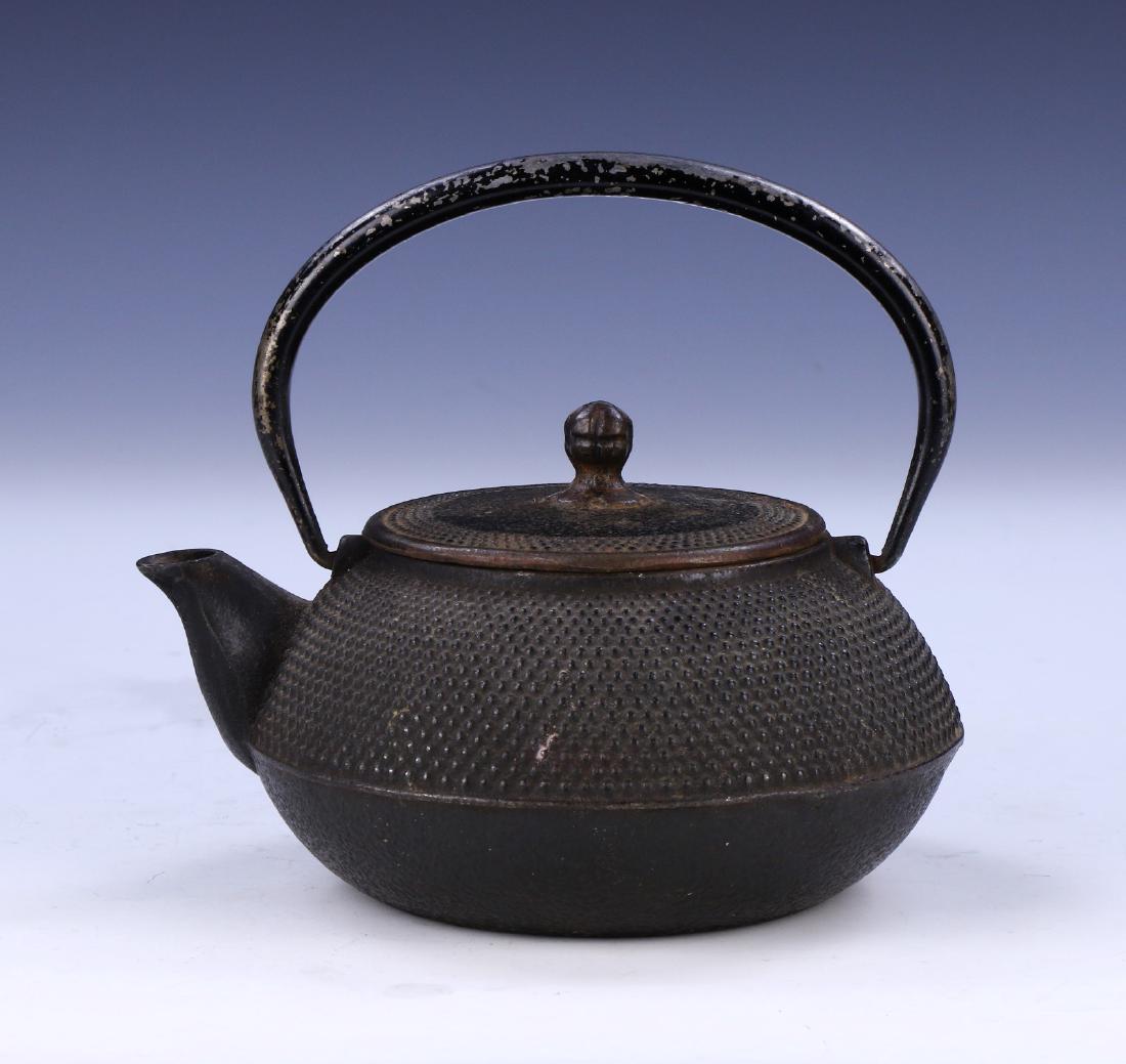 A JAPANESE ANTIQUE IRON TEAPOT: A Japanese Antique Iron Teapot: Of 19Th Century; Size: L: 6-1/2" (16.51cm)