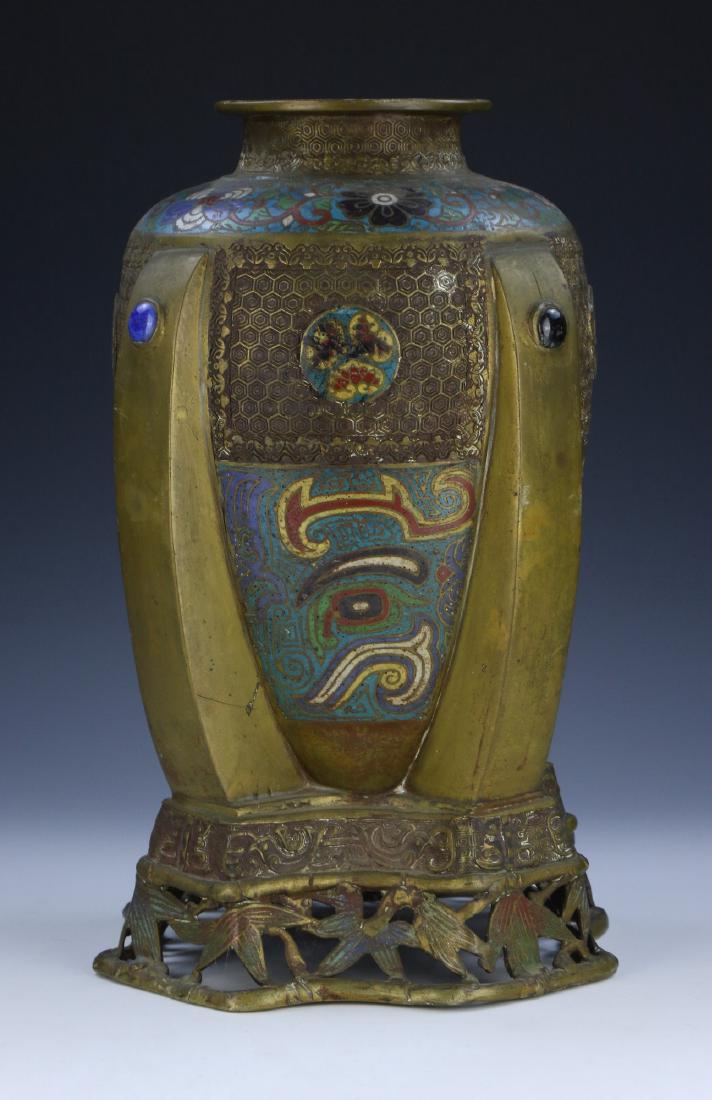 A JAPANESE ANTIQUE CLOISONNE VASE: A Japanese Antique Cloisonne Vase: Elaborately Sculpted And Of Ovoid Form, Rising From A Base Carved in Openwork As Sprouting Bamboo Stalks, Body Finely Painted With Geometric Patterns And Sprouting B