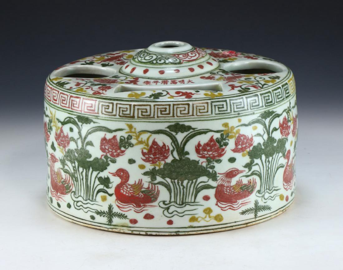 A CHINESE ANTIQUE FAMILLE ROSE PORCELAIN CANDLE HOLDER (1 of 5)