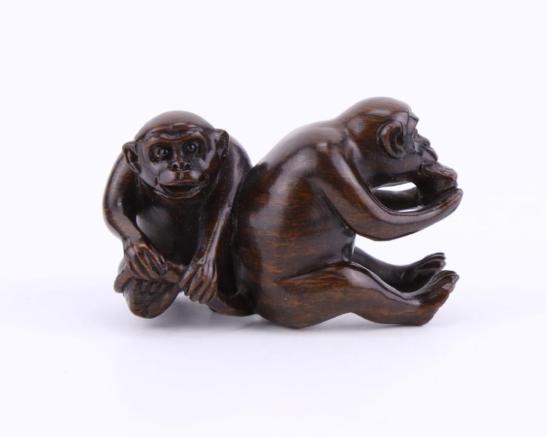 A JAPANESE ANTIQUE WOOD CARVED NETSUKE (1 of 5)