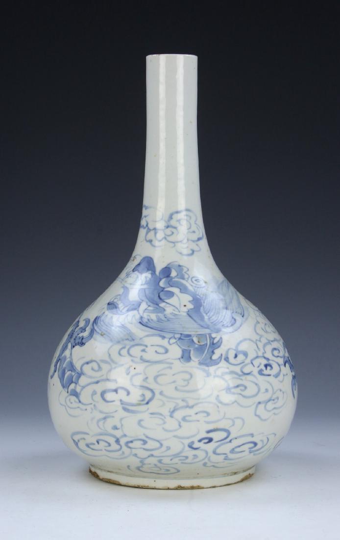 A KOREAN ANTIQUE BLUE & WHITE PORCELAIN VASE: A Korean Antique Blue & White Porcelain Vase: Potted With A Compressed Globular Body, Rising From A Base Rested On Low Feet To A Slim Neck And Rim, Body Finely Painted With A Swirling Dragon Amid Clou