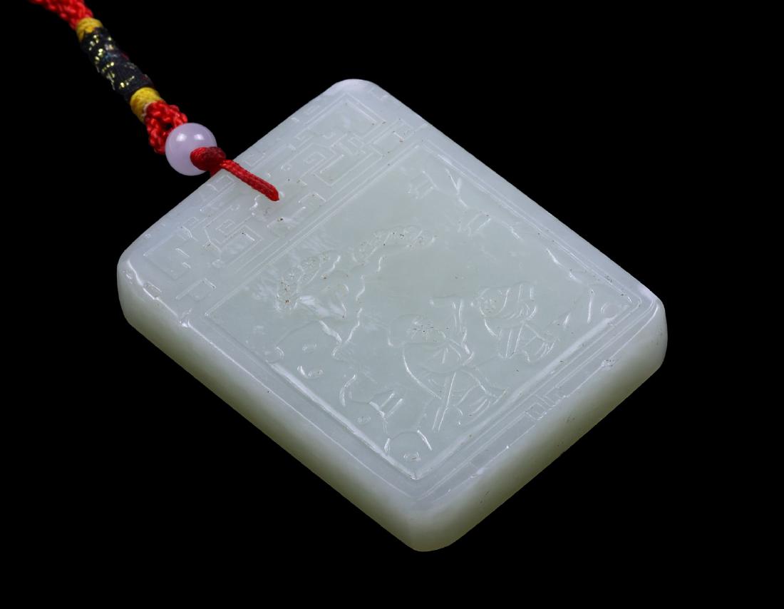 A JADE CARVED PENDANT (1 of 2)