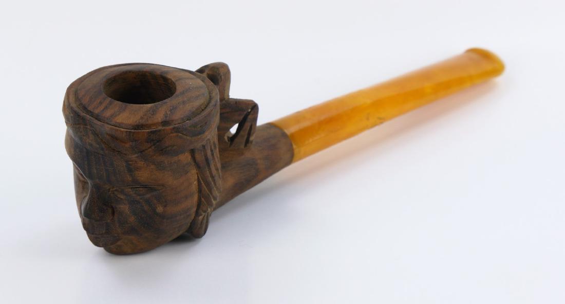 A CHINESE WOOD CARVED PIPE WITH AMBER HANDLE (1 of 4)