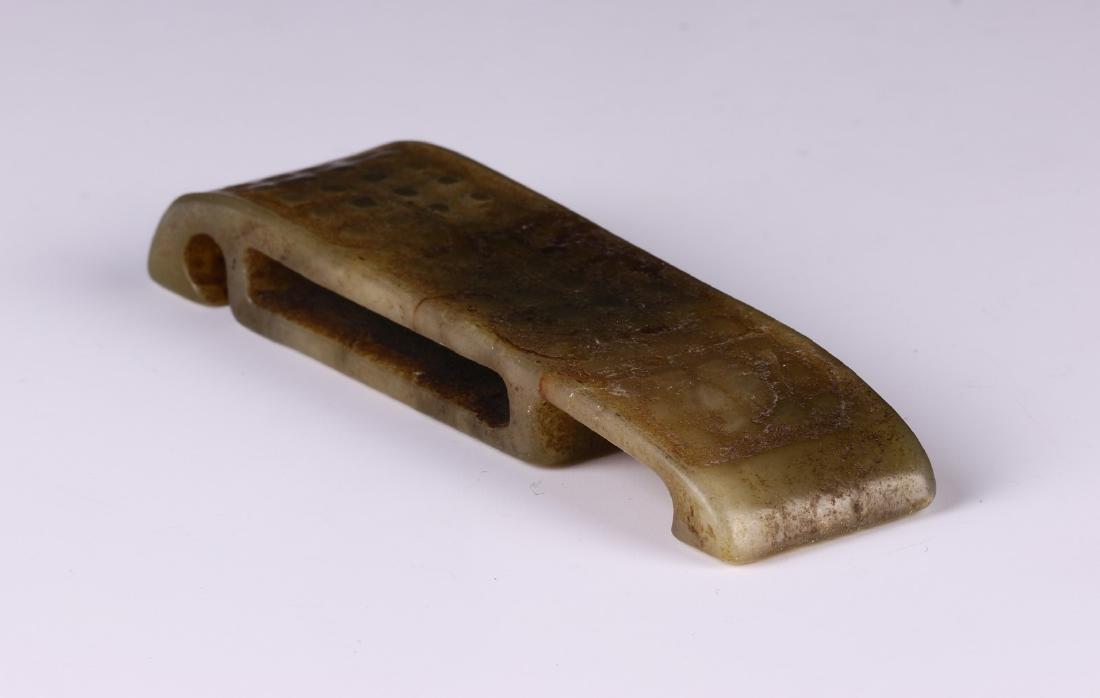 A CHINESE NEPHRITE CELADON JADE BUCKLE (1 of 3)