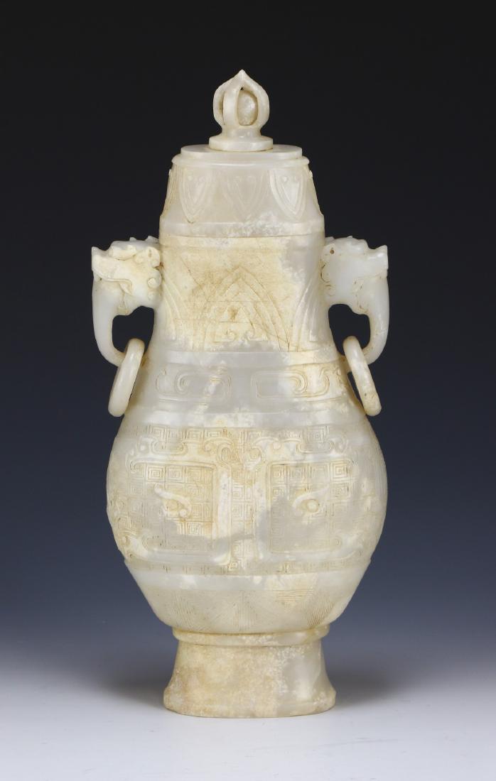 A CHINESE LIDDED JADE CARVED VASE (1 of 7)