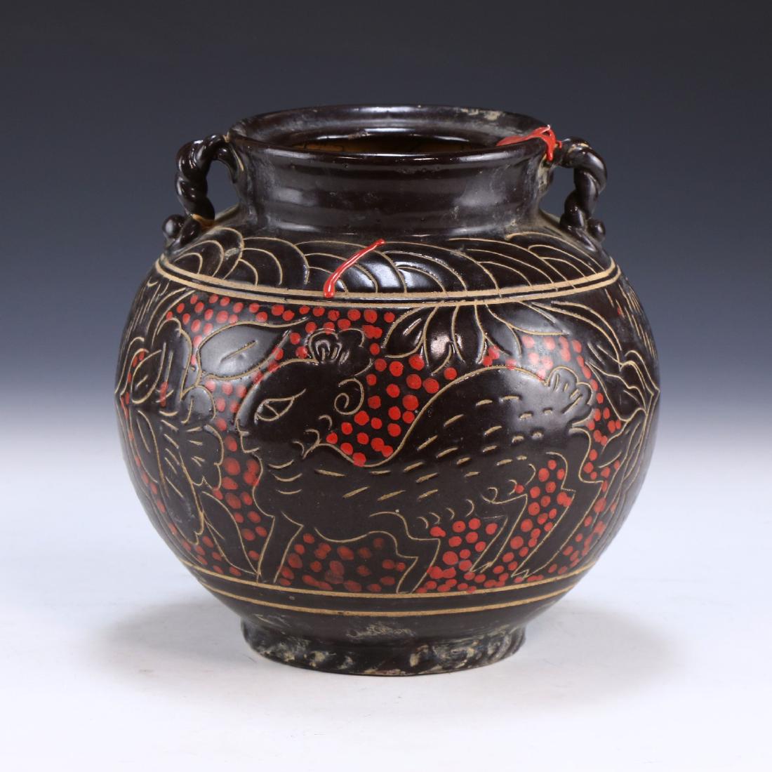 A CHINESE BLACK GLAZED PORCELAIN JAR (1 of 5)