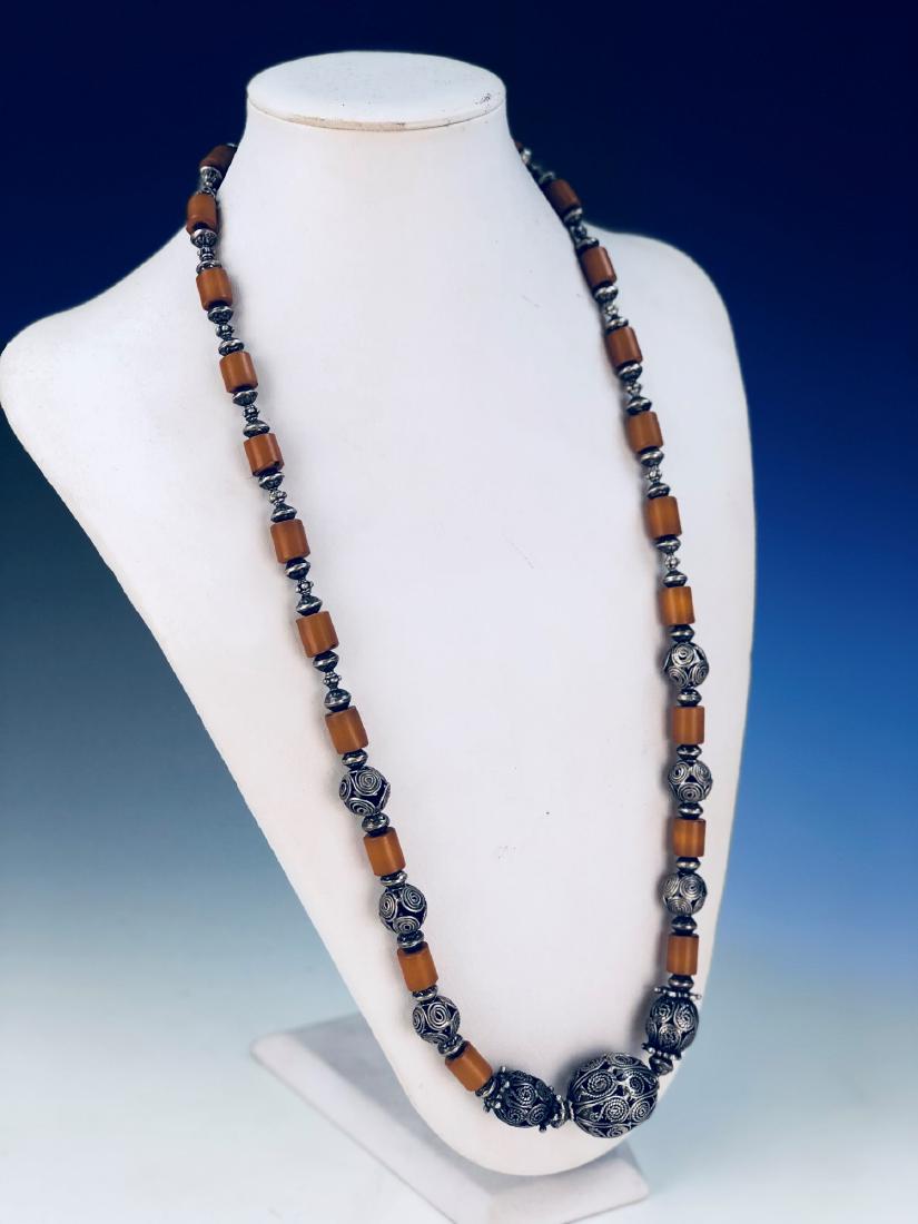 A VINTAGE SILVER AND AMBER OR LIKE NECKLACE (1 of 2)