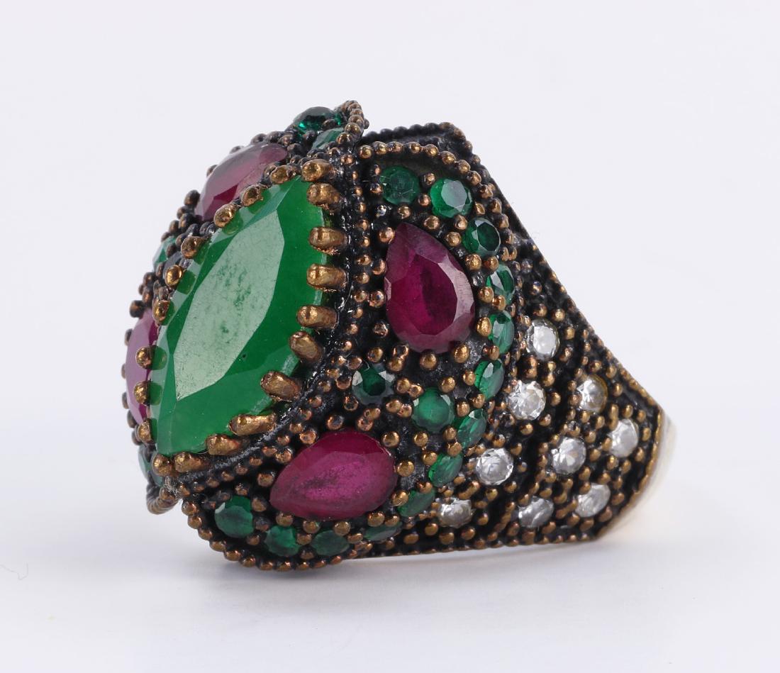A RUBY & EMERALD STERLING SILVER RING (1 of 3)