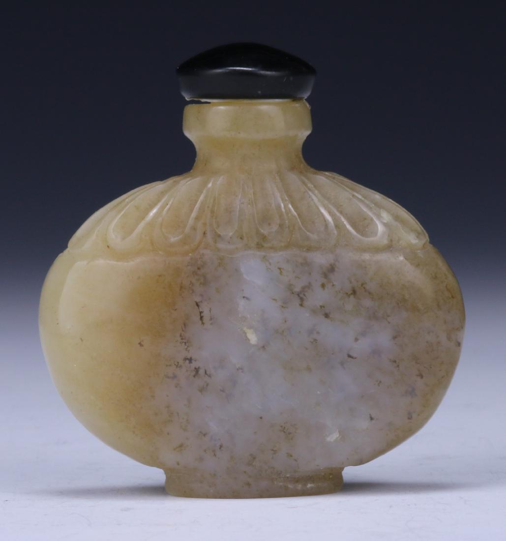 A CHINESE JADE/STONE CARVED SNUFF BOTTLE (1 of 3)