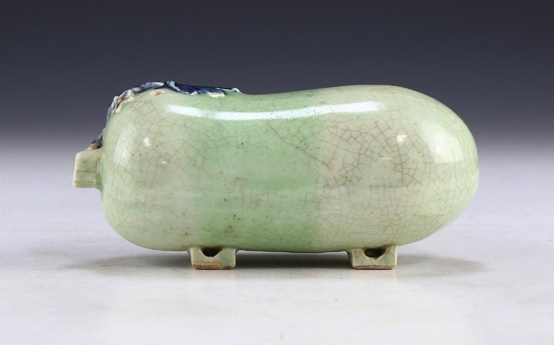 A CHINESE CELADON GLAZED PORCELAIN WATER DROPPER (1 of 5)