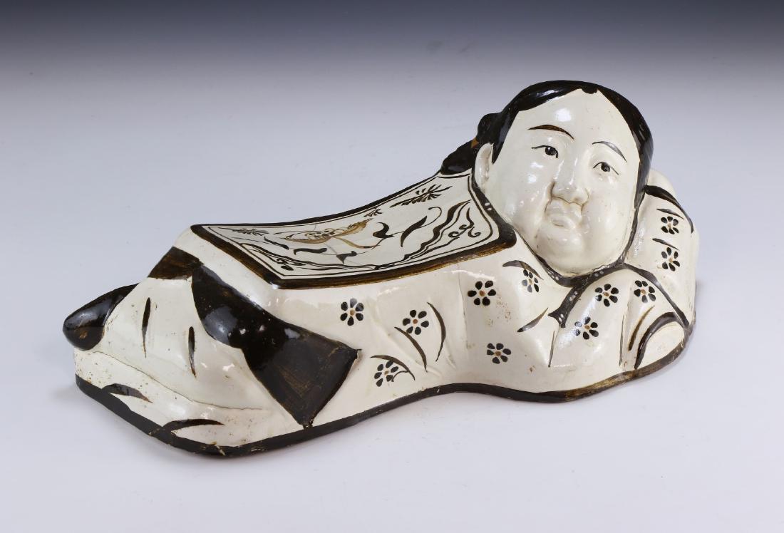A Chinese CIZHOU Cream-Glazed Porcelain Pillow (1 of 6)