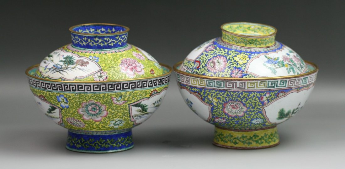 Pair Chinese Antique Enamel On Copper Bowls: Pair Chinese enamel on copper footed bowls with lids: interior with a twisting dragon in the clouds bordered with flowers and vines ; exterior with panels of mountainous landscape and temples among tr
