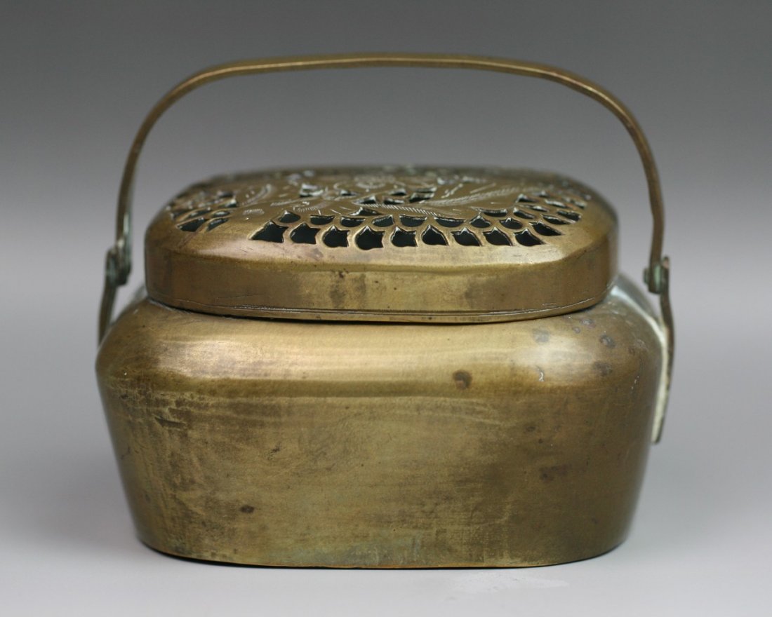 Chinese Antique Carved Bronze Hand Warmer: Chinese antique carved bronze hand warmer with handle: with meshed design of flower and foliage; possibly Minguo period; L: 4-1/2" H: 1-1/2"