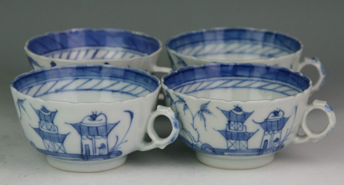 Japanese Antique Blue&White Porcelain Tea Cup Set: Japanese antique blue and white porcelain tea cup set with handle: four cups; foliated rim; with the mountainous landscape and seascape design with temples amid trees and boats floating down; 19th cen