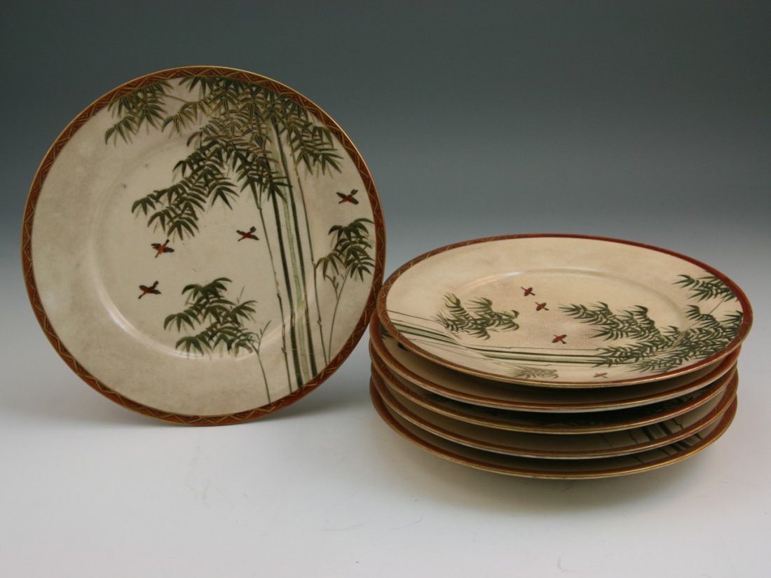 Five Old Japanese Gilt Satsuma Porcelain Plates: Five old Japanese Satsuma gilt porcelain plates: with the design of birds flying among bamboo; signed; late 19th century; D: 7"