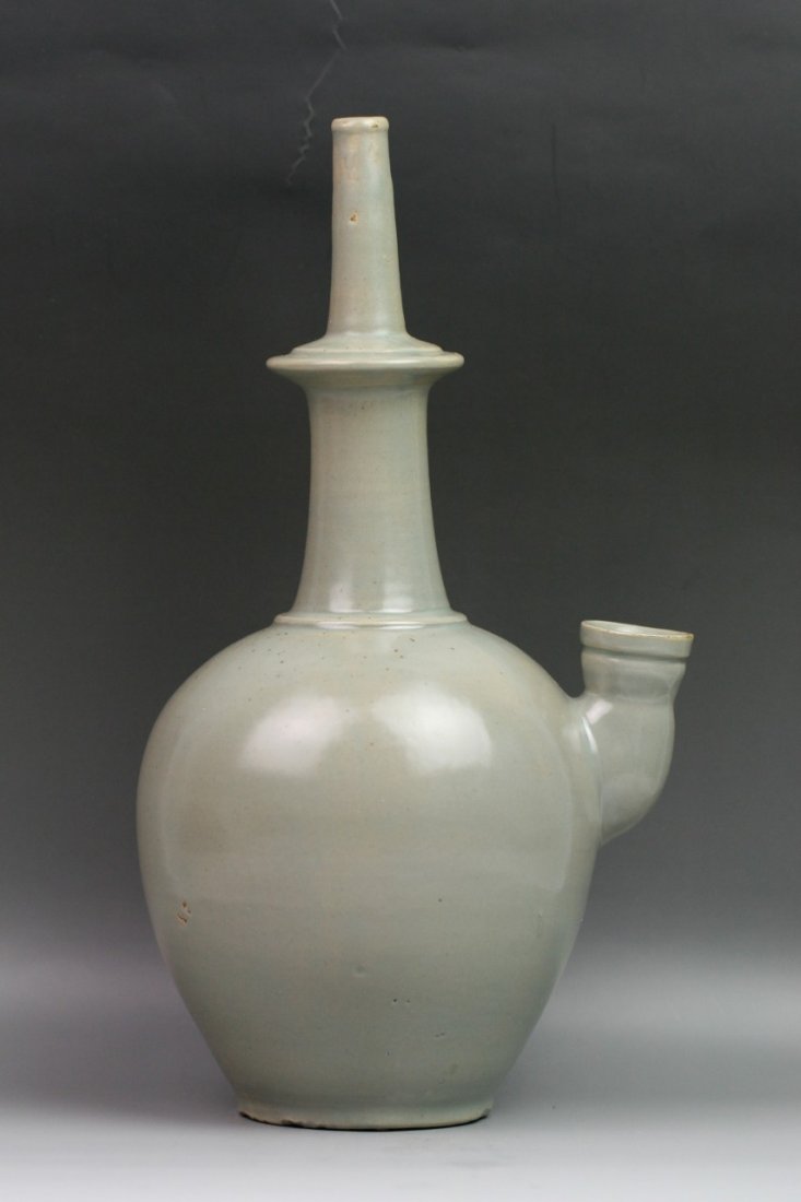 Chinese Antique Song Celadon Porcelain Kendi: Chinese antique Song-style monochrome glaze porcelain kendi or Kundika: with a tall, narrow neck and a cup-shaped spout; celadon glazed; H: 12-3/4" W: 7"