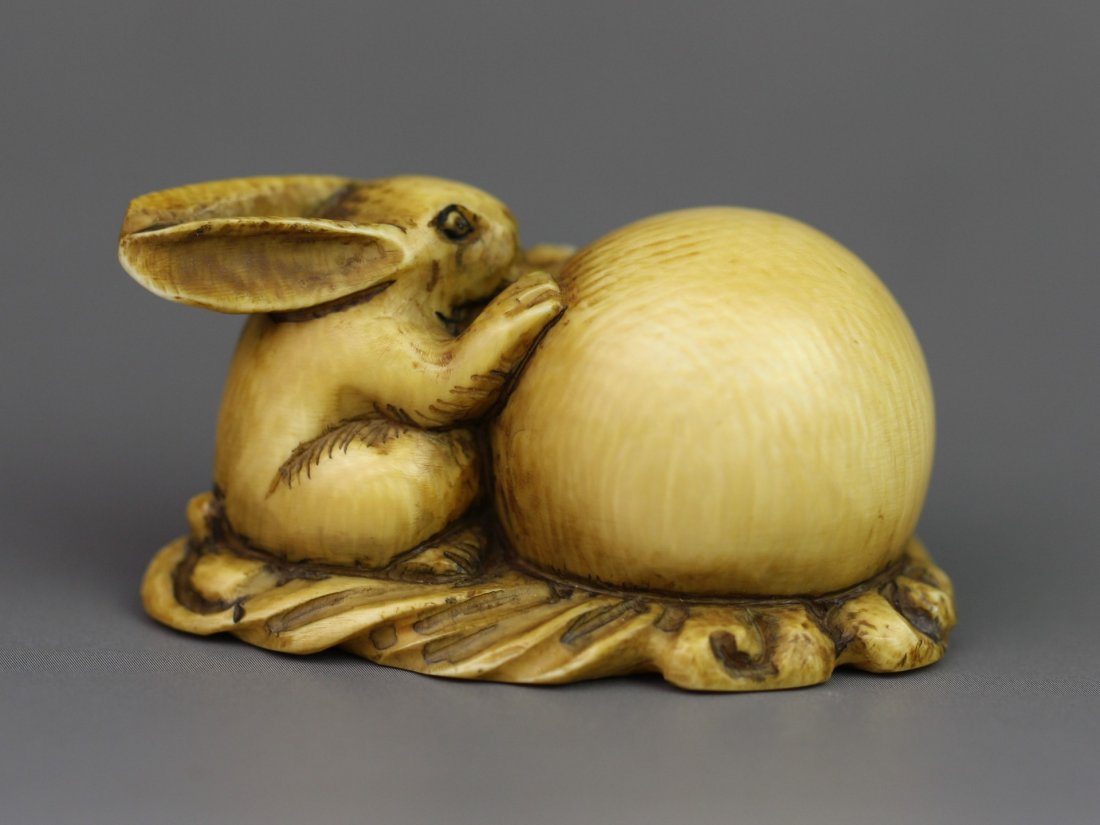 Antique Carved Ivory Netsuke: Hare And The Moon: Antique carved ivory netsuke: Hare and The Moon: signed on the bottom: 19th century; Size: L: 2"