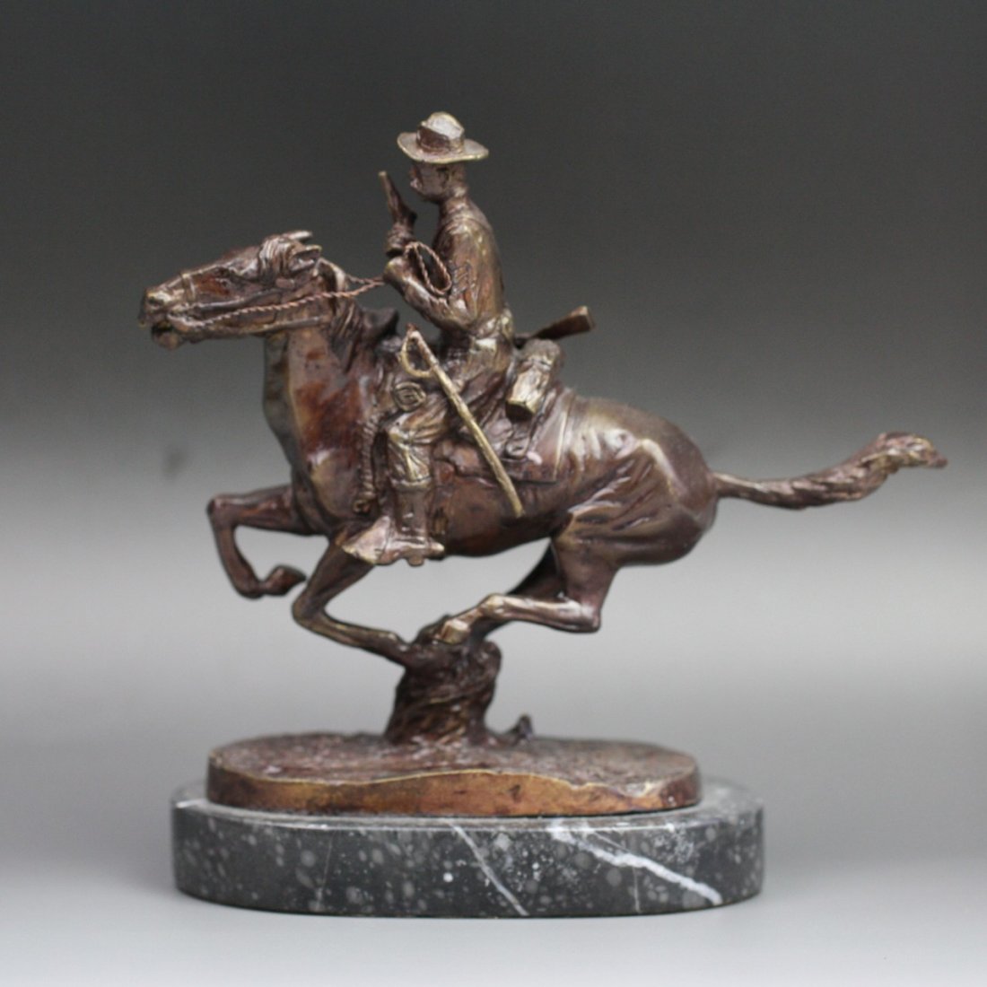 Bronze Statue Frederic Remington (1861-1909): Bronze Statue Signed Frederic Remington: Horseman With Gun: handmade and cast (1861-1909); Size: H: 7-1/2"