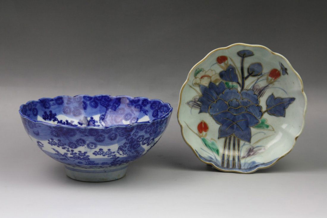 Two Japanese Antique Imari Porcelain Bowls: Two Japanese Antique Imari Porcelain Bowls: one depicting a blooming lotus branch surrounded by flower buds, the four character mark "Cheng Hua Nian Zhi" inscribed in blue on the base, one blue&white