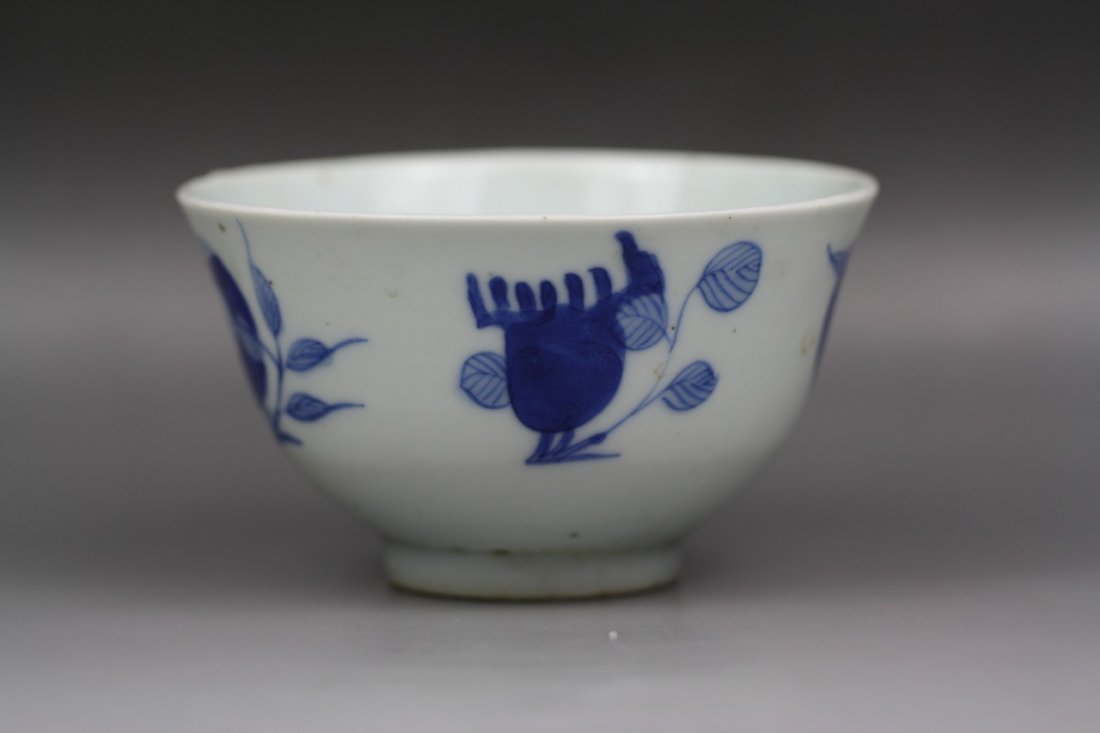 A Chinese Qing Blue & White Porcelain Bowl: A Chinese Qing Blue & White Porcelain Bowl: the exterior painted in blue with peaches, bats and characters "Shou" , inside and outside all covered with a pale white glaze, signed on the base, Mid to L