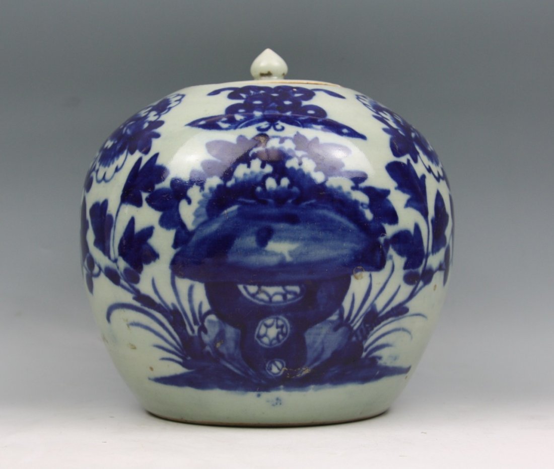 A Chinese Late Qing Blue & White Jar With Cover: A Chinese Qing Blue & White Jar with Cover: painted in deep underglaze-blue on one side of the globular body with peony blossoms issuing from rockwork, circular cover painted with three bats in flight