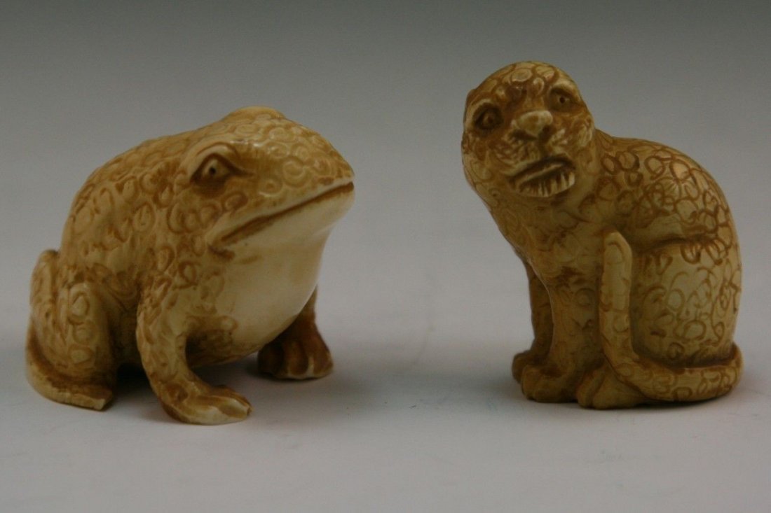Two Antique Ivory Netsuke: Toad And Cat: Two finely carved Antique Ivory Netsuke: Toad and Cat, with inlaid eyes; Size: H: 1-1/2"